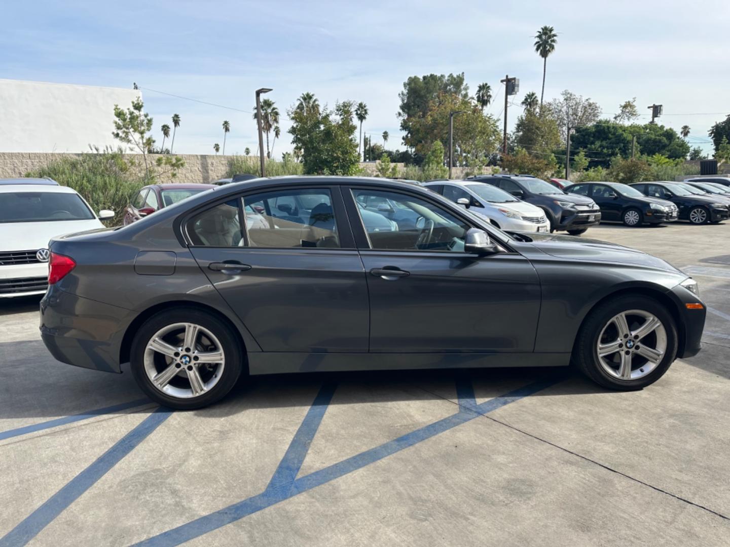 2014 Gray /Black BMW 3-Series 320i xDrive (WBA3C3C57EP) with an 2.0L L4 DOHC 16V engine, Automatic transmission, located at 30 S. Berkeley Avenue, Pasadena, CA, 91107, (626) 248-7567, 34.145447, -118.109398 - Navigation! Back-up camera! 2014 BMW 3-Series 320i xDrive - The Ideal Choice in Pasadena, CA Looking for top-tier BHPH cars in Pasadena, CA? Look no further than the 2014 BMW 3-Series 320i xDrive. As a reputable BHPH dealer in Los Angeles, CA, we take pride in offering some of the finest pre-own - Photo#5